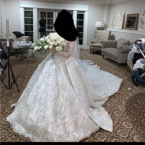 Wedding dress hand designed by Muhammad Murad. Only worn once